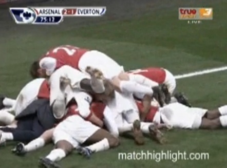 Arsenal bundle on Laurent Koscielny after his headed winner against Everton